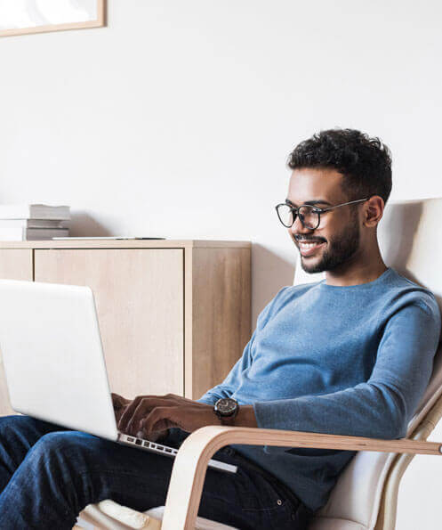 A young Man working on his laptop