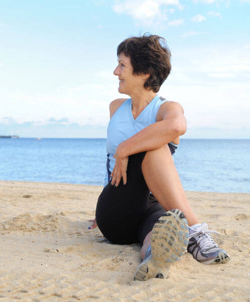 A Beautiful Woman Doing Stretching on Beach